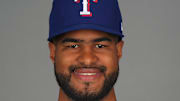 Feb 19, 2025; Surprise, AZ, USA; Texas Rangers pitcher Jose Corniell (87) poses for a photo during Media Day at Surprise Stadium