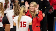Nebraska coach Dani Busboom Kelly and middle blocker Andi Jackson celebrate against Kansas in the NCAA Tournament Regional Semifinal. 