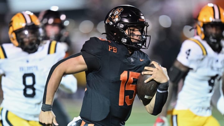 Massillon (Ohio) quarterback DaOne Owens runs away from Valdosta (Georgia) defenders during a 28-17 Massillon win in 2023.