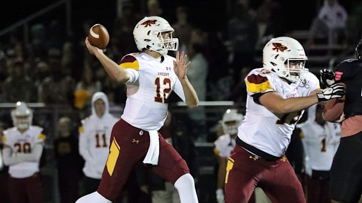 Ankeny High senior quarterback and ISU recruit JJ Kohl (12) spots an open receiver as the Ankeny Hawks compete against the North High Polar Bears on Friday, October 7, 2022, at Grubb Stadium in Des Moines.

Dsm1009hawks R