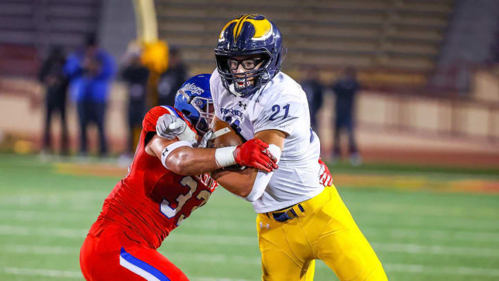 Oak Ridge tight end Kaleb Edwards fights off a Folsom defender in the Sac-Joaquin Section championship game