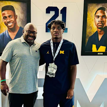 Michigan running backs coach Tony Alford with five-star running back commit Savion Hiter.
