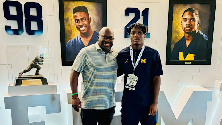 Michigan running backs coach Tony Alford with five-star running back commit Savion Hiter.