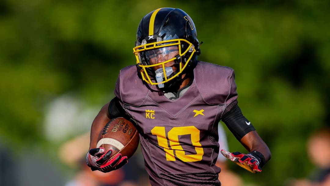 Detroit King's Daryl Flemister runs with the ball in the opening game of the 2023 season.