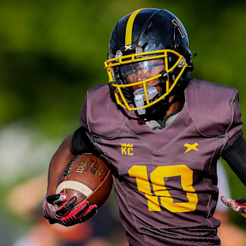 Detroit King's Daryl Flemister runs with the ball in the opening game of the 2023 season.