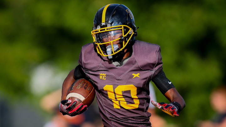 Detroit King's Daryl Flemister runs with the ball in the opening game of the 2023 season.