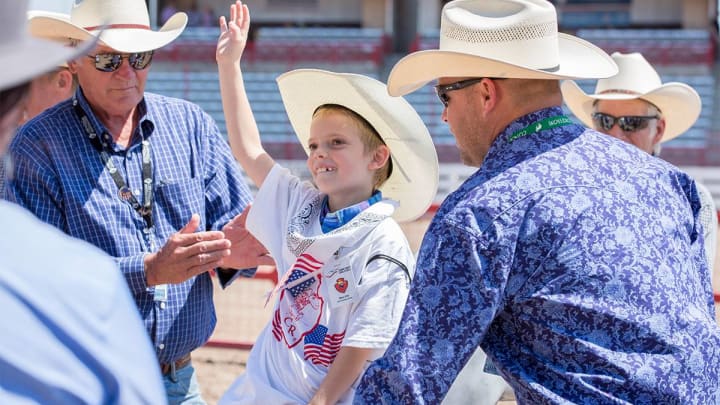 Volunteers, like those seen here helping work the Cheyenne Frontier Days Challenge Rodeo, guarantee the events success each year. In all, more than 3,000 volunteers work on nine committees that oversee all aspects of the rodeo. 