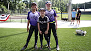 Ellery Thomas (r.) with some teammates in front of the new Rhyne Park softball fields.