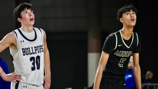 Carter Nilson, left, of Gonzaga Prep, and Isaiah Englund take a look at a shot in the Bullpups' overtime win in the Class 4A 