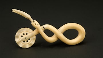 A scrimshaw jagging wheel/pie crimper made from a sperm whale tooth—just one example of an unusual love token from the days of yore.