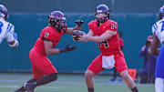Coppell QB Eddie Griffin hands off to Omarion Mbakwe in a 2023 Texas high school football game.