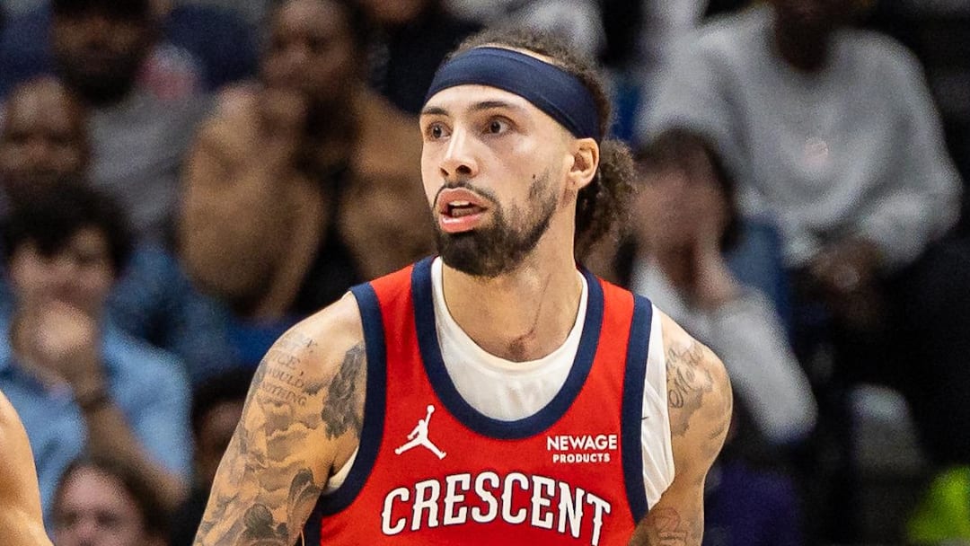 New Orleans Pelicans guard Jose Alvarado dribbles against Portland Trail Blazers guard Caleb Love.