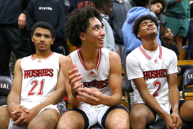 Jared McCain (middle) celebrates following his team's victory over Sierra Canyon in the 2022 CIF Southern Section Open Division championship game. 