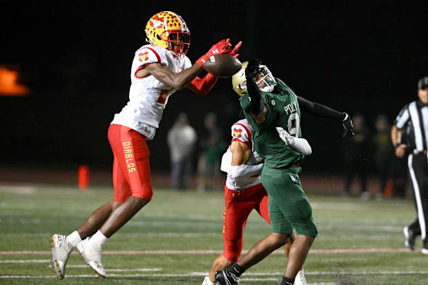 Mission Viejo defensive back Dijon Lee, left, has committed to play college football for the Alabama Crimson Tide.