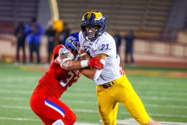 Oak Ridge tight end Kaleb Edwards fights off a Folsom defender in the Sac-Joaquin Section championship game