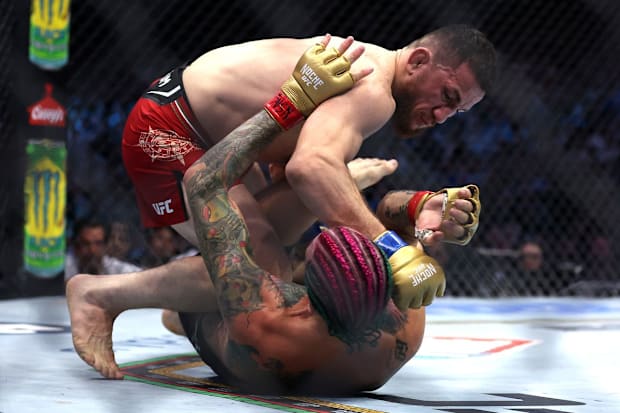 Sean O'Malley and Merab Dvalishvili during their first fight at UFC 306.