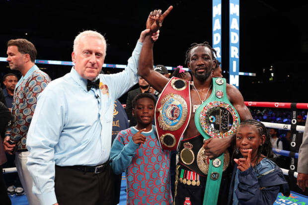 Terence Crawford celebrates title win with his children.