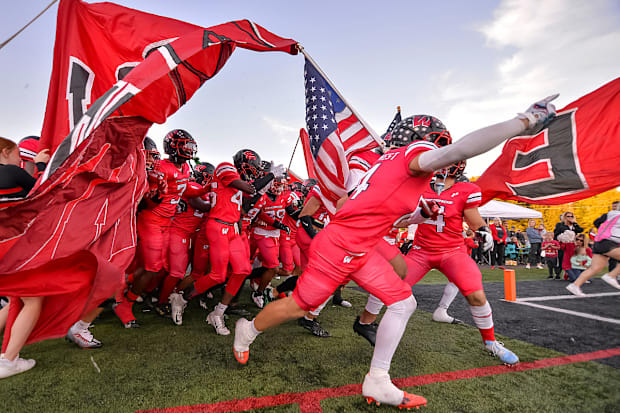 Lakota West High School football players take the field.