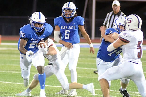 Junction City running back DJ Giddens takes advantage of an opening provided by his blockers during a game against Seaman.