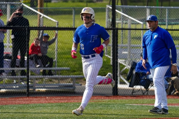 Max Clark trots around the bases after homering for Franklin Community High School (Indiana).