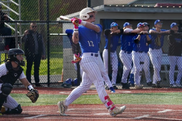 Franklin Community High School (Indiana) slugger Max Clark admires a home run.
