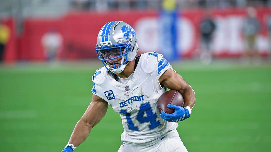Detroit Lions wide receiver Amon-Ra St. Brown (14) carries the ball after making a catch against the Buffalo Bills in the second half at New Highmark Stadium. Mandatory Credit: Mark Konezny-Imagn Images