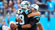 Nov 4, 2018; Charlotte, NC, USA; Carolina Panthers quarterback Cam Newton (1) hugs tight end Greg Olsen (88) after a touchdown in the second quarter against the Tampa Bay Buccaneers at Bank of America Stadium. 