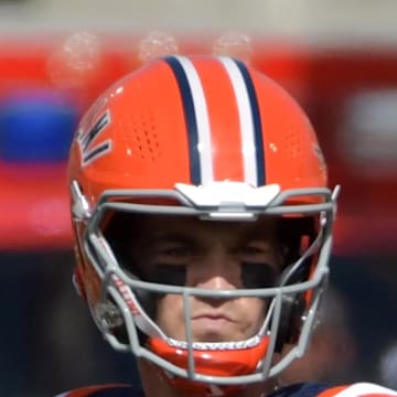 Sep 14, 2024; Champaign, Illinois, USA;  Illinois Fighting Illini quarterback Luke Altmyer (9) drops back to pass against the Central Michigan Chippewas during the first half at Memorial Stadium. Credit: Ron Johnson-Imagn Images