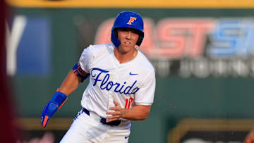 Florida infielder Colby Shelton (10) rounds second base as he eyes third during the first inning of an NCAA baseball matchup at 121 Financial Ballpark in Jacksonville, Fla. Florida State defeated Florida 14-3.