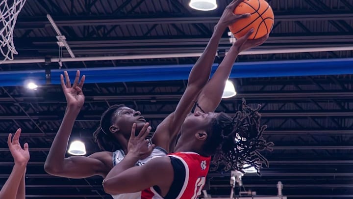 Evans High's Dewayne Dixon, left, recently had 17 points, five rebounds and four blocked shots in a 55-48 loss to Oak Ridge in the inaugural Chocolate Thunder Classic.