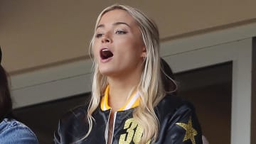 May 11, 2024; Pittsburgh, Pennsylvania, USA;  Louisiana State University gymnast Olivia Dunn (middle) cheers for  her boyfriend Pittsburgh Pirates starting pitcher Paul Skenes (not pictured) as he pitches in his major league debut against the Chicago Cubs during the fourth inning at PNC Park. Mandatory Credit: Charles LeClaire-USA TODAY Sports