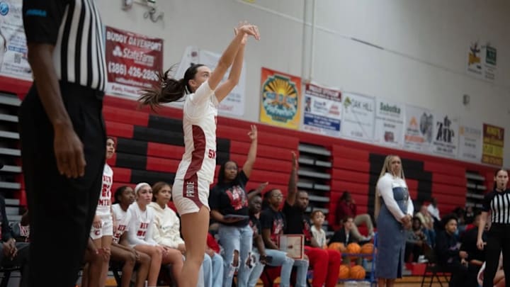 New Smyrna Beach's Riley France lets a 3-pointer fly in a recent game. On Feb. 20, the junior had 15 points on five 3-pointers, and made two steals to propel the Barracudas past Springstead, 64-26, in a Class 5A, Region 2 semifinal.