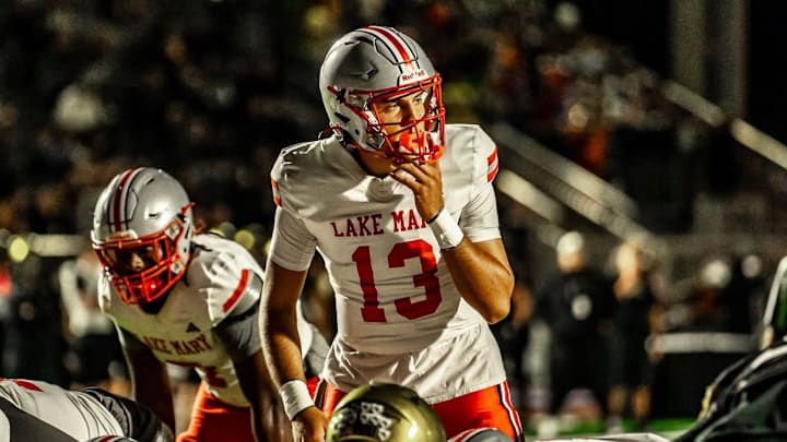 Lake Mary quarterback Noah Grubbs (13) threw a Hail Mary pass that was tipped to wide receiver Barrett Schulz, who then lateraled to Tavarius Brundidge, who ran the final 4 yards into the end zone on the game's final play to help the Rams shock Vero Beach, 28-27, for the Class 7A state title on Saturday, Dec. 13, 2025. Lake Mary quarterback Noah Grubbs (13) threw a Hail Mary pass that was tipped to wide receiver Barrett Schulz, who then lateraled to Tavarius Brundidge, who ran the final 4 yards into the end zone on the game's final play to help the Rams shock Vero Beach, 28-27, for the Class 7A state title on Saturday, Dec. 13, 2025.