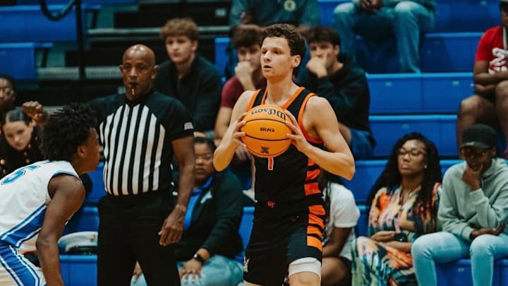 Winter Park senior guard Will Ryan, with ball, scored 26 points to power the Wildcats past Kissimmee Gateway, 73-51.