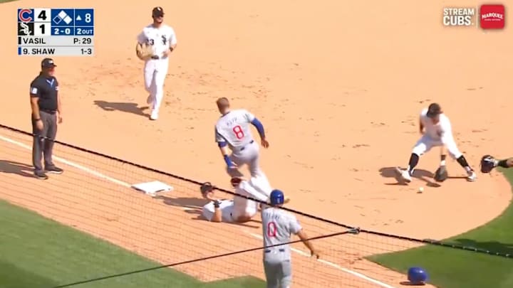 The Cubs ended up scoring a run on this play thanks to a ruling by the ump. 