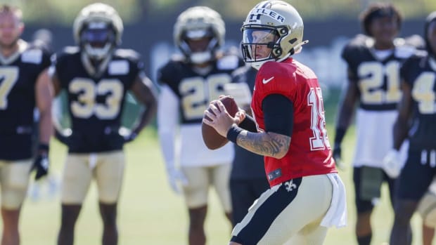 Quarterback Spencer Rattler (18) throws during a New Orleans Saints practice  