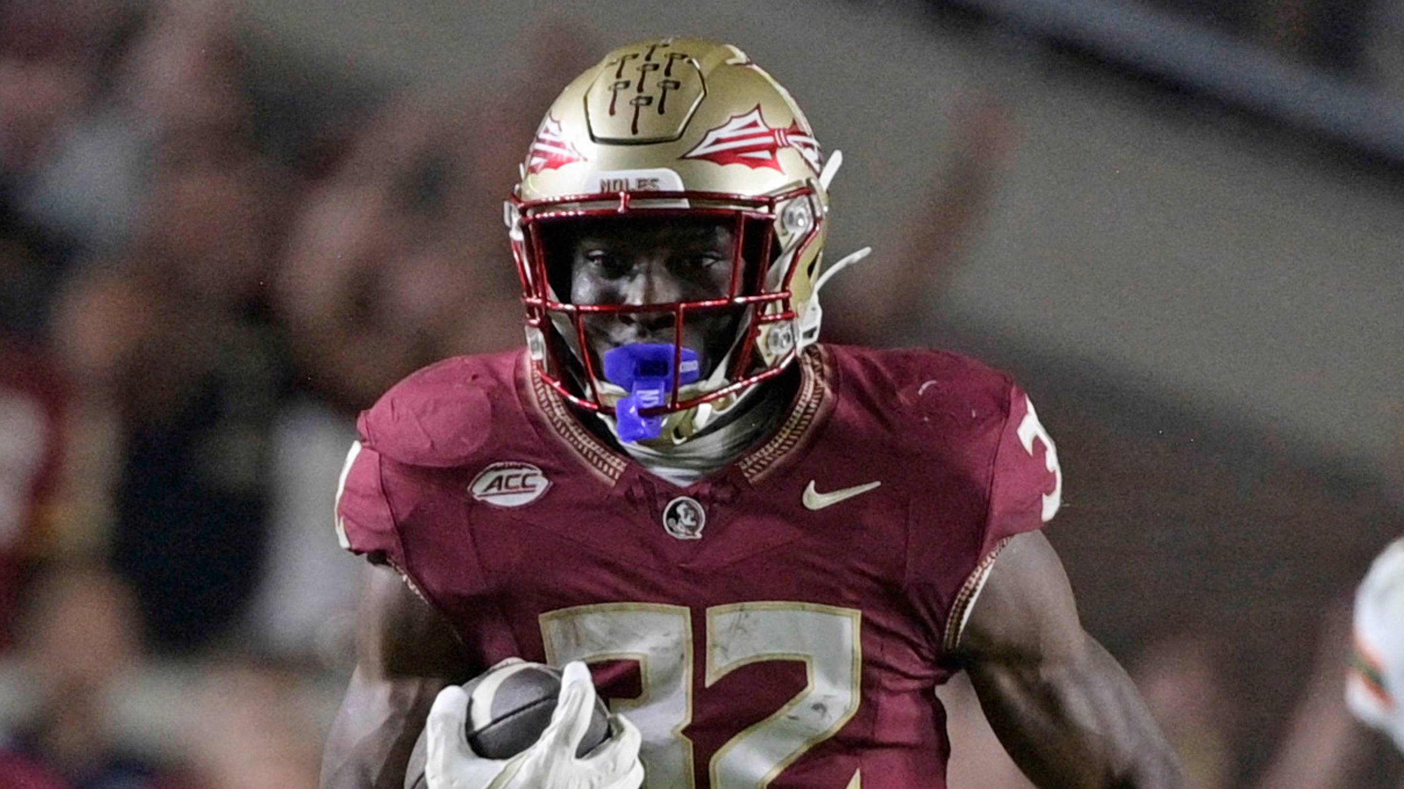 Oct 4, 2025; Tallahassee, Florida, USA; Florida State Seminoles running back Ousmane Kromah (32) runs during the first half against the Miami Hurricanes at Doak S. Campbell Stadium. Mandatory Credit: Melina Myers-Imagn Images