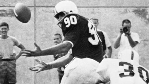 Indiana's Rick Spickard tries to haul in a pass in the 1965 season opener against Kansas State at Memorial Stadium.