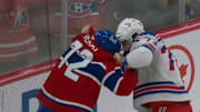 Canadiens D Arber Xhekaj and Rangers F Matt Rempe drop their gloves and scrap. 
