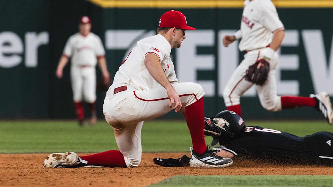 Nebraska shortstop Dylan Carey applies a tag at second base against Louisville in the Amegy Bank College Baseball Series in Arlington, Texas. Nebraska shortstop Dylan Carey applies a tag at second base against Louisville in the Amegy Bank College Baseball Series in Arlington, Texas.