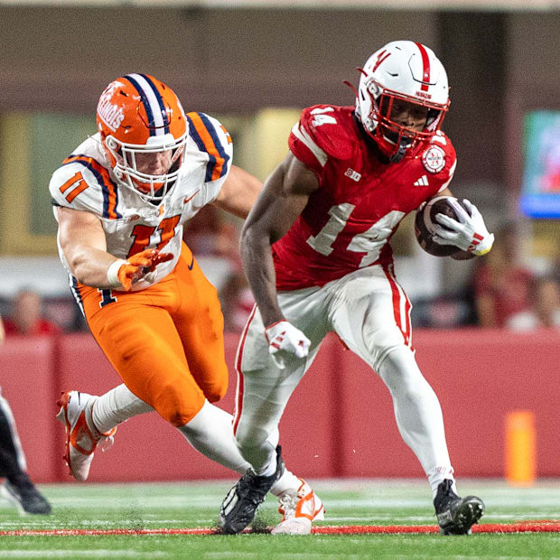 Nebraska running back Rahmir Johnson rushes for a 9-yard gain against Illinois.