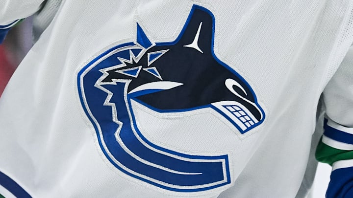 Vancouver Canucks white jersey.