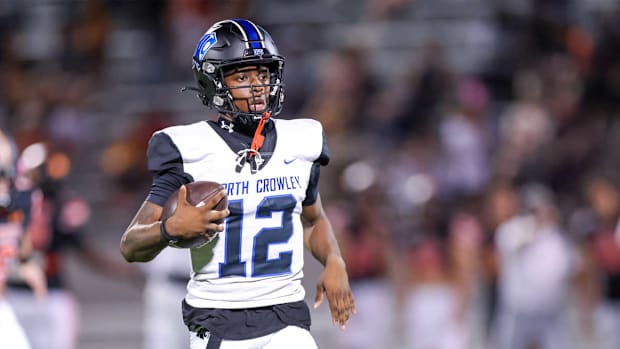 North Crowley QB Chris Jimerson Jr. runs toward the endzone against Rockwall in a Week 4 Texas high school football game.