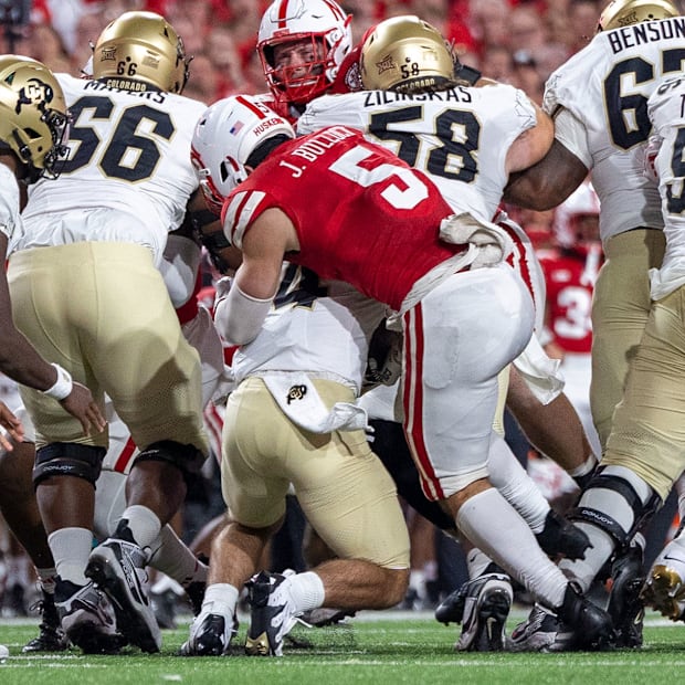 Nebraska linebacker John Bullock drops Colorado running back Charlie Offerdahl for a short loss on a fourth-and-1.