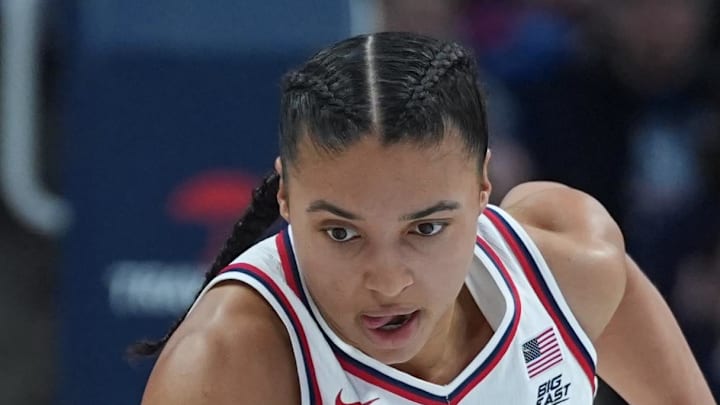 UConn Huskies guard Azzi Fudd returns the ball against the Creighton Bluejays.