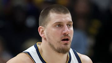 Nikola Jokic #15 of the Denver Nuggets dribbles the ball against the Atlanta Hawks.