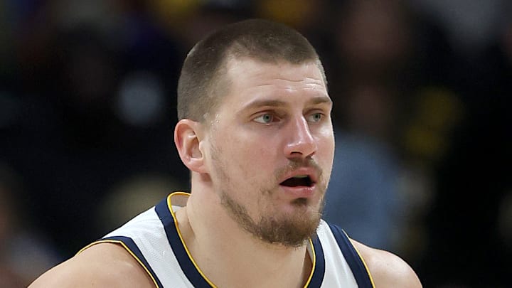 Nikola Jokic #15 of the Denver Nuggets dribbles the ball against the Atlanta Hawks.