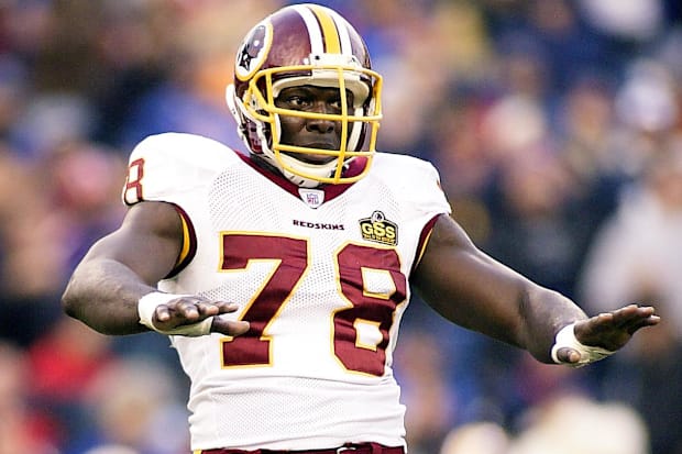 Washington defensive end Bruce Smith gestures on the field against the Buffalo Bills at Ralph Wilson Stadium.