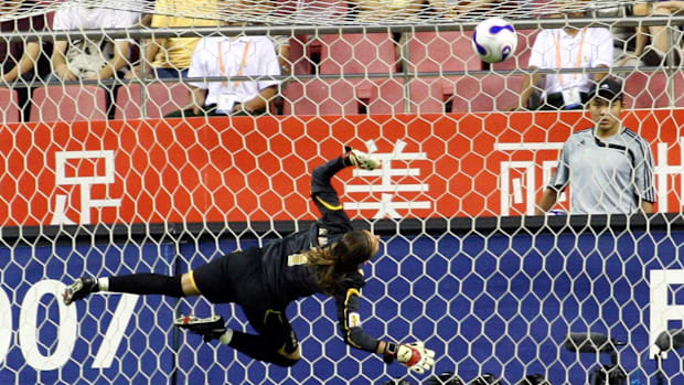 Norway goalkeeper Bente Nordby diving for the ball at the 2007 FIFA Women's World Cup.