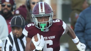Harper Woods receiver Dakota Guerrant runs by Airport High School Colin Nowak for a touchdown during first half action at Harper Woods High School on Saturday, Nov 11, 2023.
